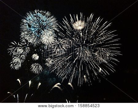 Celebration with fireworks, large and beautiful sky at dark.