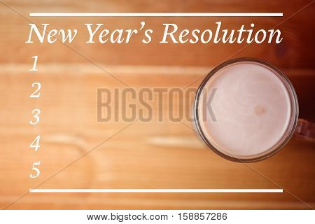 New Years Resolution List against hot chocolate cup