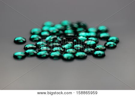 Close up of green jewel or gem - emrald type
