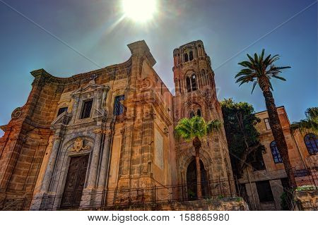 Belltower of church Martorana with palm trees, Palermo. Sicily. Beautiful architecture of the historical district.