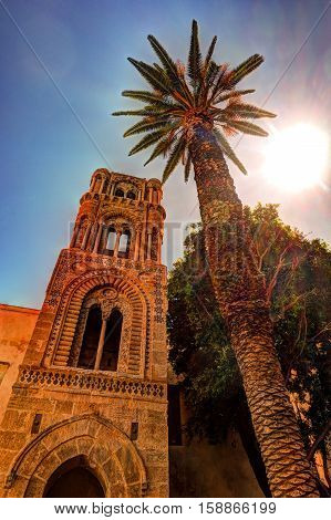 Belltower of church Martorana with palm trees, Palermo. Sicily. Beautiful architecture of the historical district.