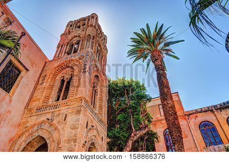 Belltower of church Martorana with palm trees, Palermo. Sicily. Beautiful architecture of the historical district.