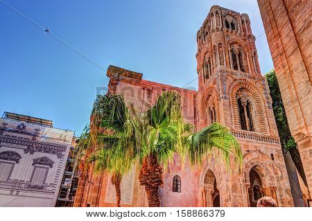 Belltower of church Martorana with palm trees, Palermo. Sicily. Beautiful architecture of the historical district.