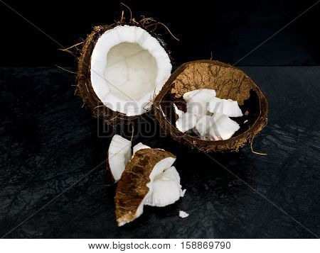 The coconut  on the color of the stone table and dark background