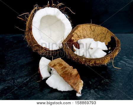 The coconut  on the color of the stone table and dark background
