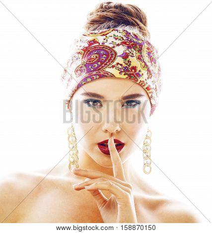 young pretty modern girl with bright shawl on head emotional posing isolated on white background, asian people ethnicity
