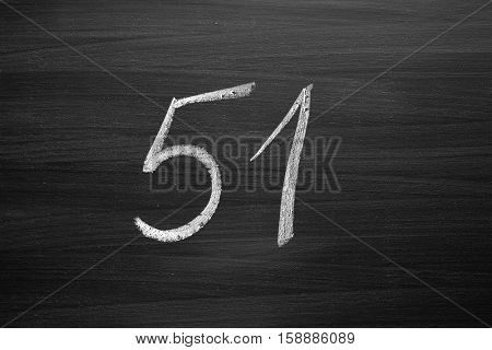 number fifty one enumeration written with a chalk on the blackboard