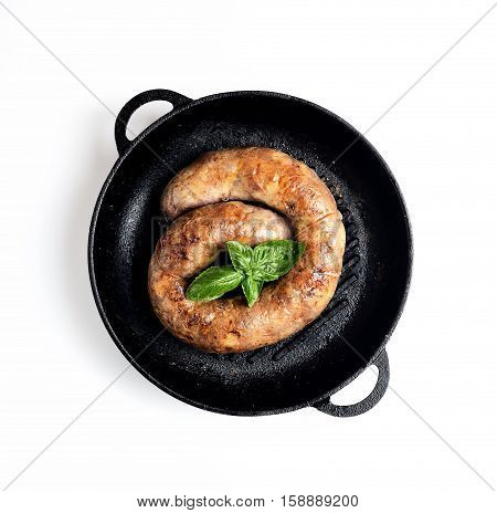 homemade sausages in a pan on a white background