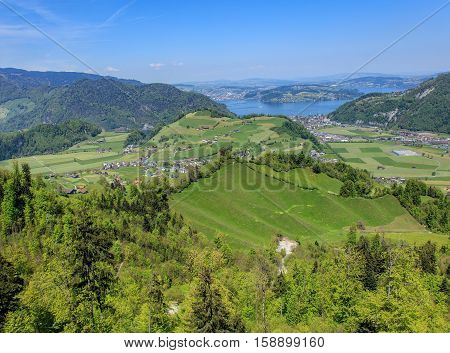 Springtime view in the Swiss Canton of Nidwalden Lake Lucerne in the background. The picture was taken from the open deck of a cable car gondola heading from the Mt. Stanserhorn, at the beginning of May.