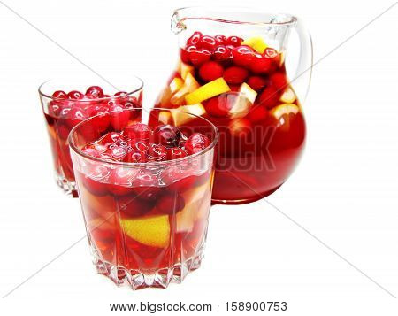 fruit cruchon cocktail punch in jug and glasses with ice and fruit