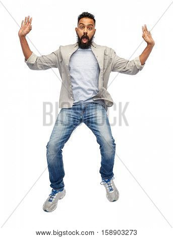 freedom, motion and people concept - indian young man jumping in air