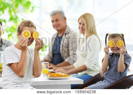Happy large family having breakfast on kitchen