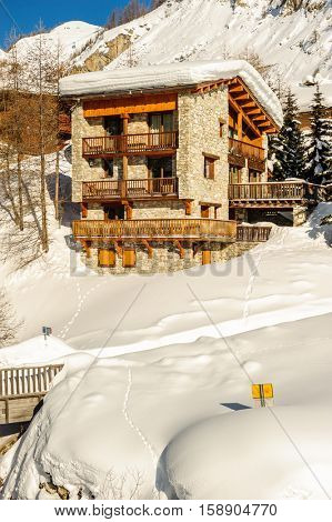 Alpine winter mountain landscape. French Alps covered with snow in sunny day. Val-d'Isere, France