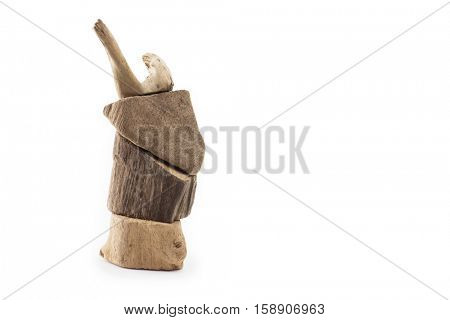 Pieces of drift wood stacked up to look like an deer or reindeer. Isolated on white