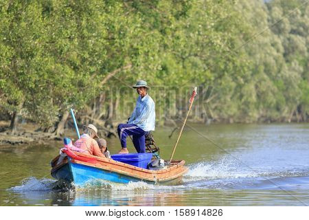 RANONG THAILAND - MARCH 18 :southern thai fishery in ranong province on long tail boat in ranong river on march 18 2015 in ranong thailand