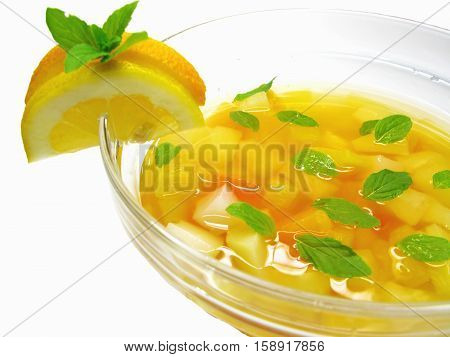fruit cruchon cocktail punch in bowl with ice and fruit