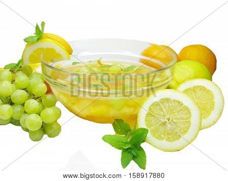 fruit cruchon cocktail punch in bowl with ice and fruit