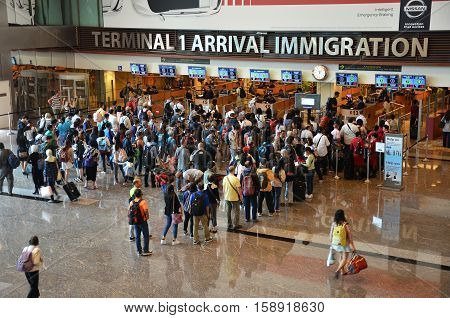 Travelers Enter Immigration Control At Changi International Airport