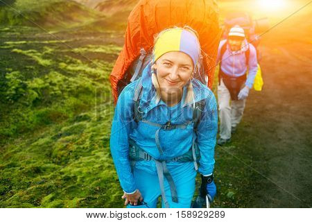 hikers on the trail in the Islandic mountains. Trek in National Park Landmannalaugar, Iceland