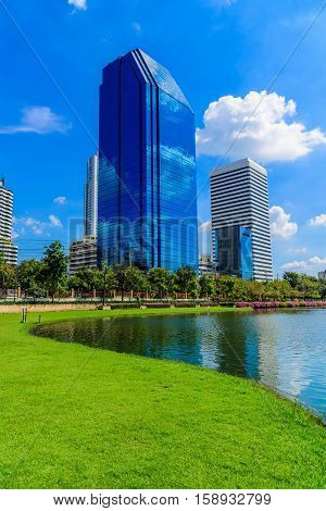 Bangkok city on blue sky with cloud at Benchakitti ParkThailand.