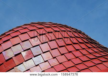 detail of red modern ceramic tiles rof structure