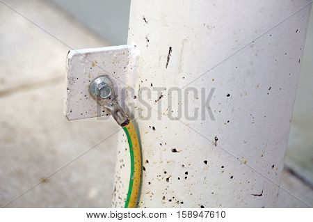 Electrical ground wires connected to a metal junction plate