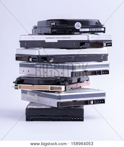 Pile of old hard drive on white background.