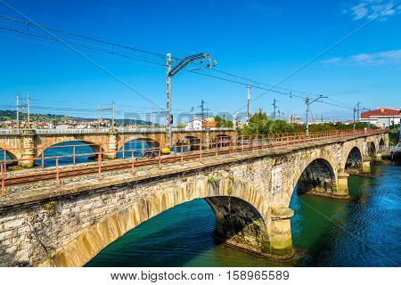 Railway bridges over the Bidasoa river on the France - Spain border.