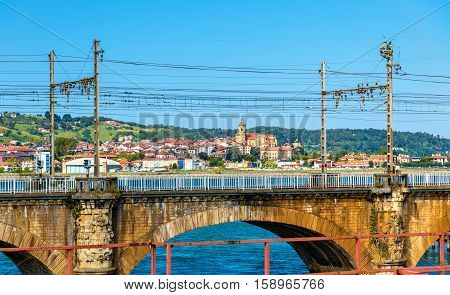 Railway bridges over the Bidasoa river on the France - Spain border.
