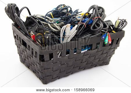 Big pile of computer cables neatly sorted in box - basket - isolated on white