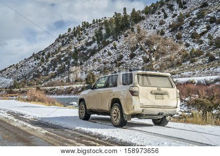 BURNS, CO, USA - NOVEMBER 27, 2016:  Winter travel on a dirt road along Colorado River with Toyota 4Runner SUV (2016 Trail edition).