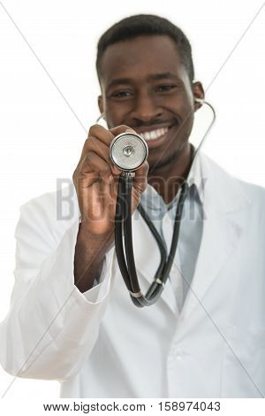African-American black doctor man holding sthethoscope isolated white background.