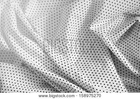 Texture background of black polka dot on white farbric