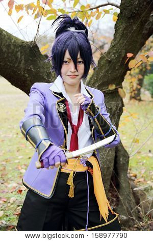 Marugame, Kagawa, Japan -  November 20, 2016: Young japanese girl dressed in cosplay costume at Mamugame-Jou Park. Photo taken in Marugame Cosplay Convention