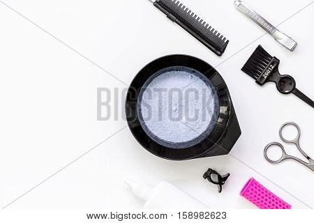 Tools for hair dye and hairdye top view on white background