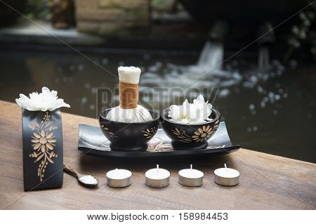 Spa massage compress balls, herbal ball on the wooden with treaments spa , Thailand, select focus