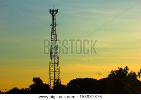 Sunset cell phone tower in the countryside