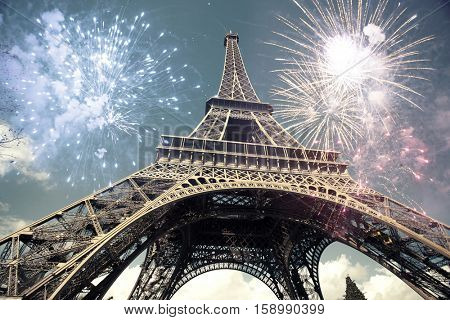 Eiffel tower (Paris, France) with fireworks - Celebrating New Year in the city