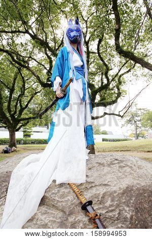 Marugame, Kagawa, Japan -  November 20, 2016: Young japanese girl dressed in cosplay costume at Mamugame-Jou Park. Photo taken in Marugame Cosplay Convention