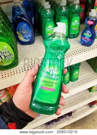 Plattsburgh, Usa - September 10, 2018: A Man Holding A Palmolive Cleaning Agent. Is A Cleaning Produ