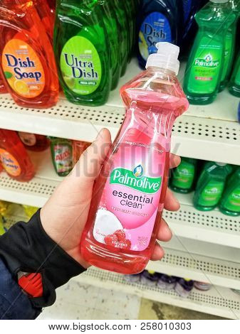 Plattsburgh, Usa - September 10, 2018: A Man Holding A Palmolive Cleaning Agent. Is A Cleaning Produ