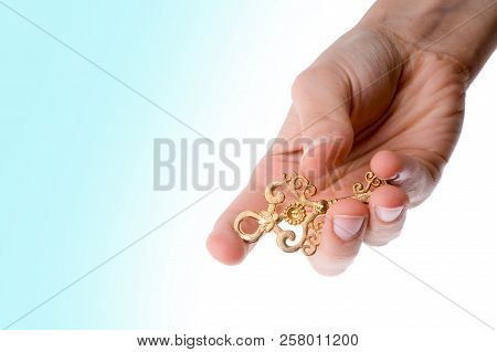 Hand Holding An Isolated Paper House With A White Background