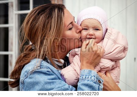 Atmospheric Lifestyle Photo Of Young Beautiful  Darkhaired Woman  In Knitting Hat, In A Leather Jack
