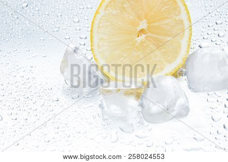 Lemon Ring With Ice On A Silvery Background Closeup