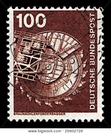 GERMANY-CIRCA 1975:A stamp printed in Germany shows image of machinery for brown coal mining, circa 1975.