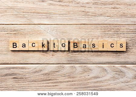 Back To Basics Word Written On Wood Block. Back To Basics Text On Table, Concept.