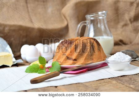 Homemade Lemon Bundt Cake With Lemon, Melissa, Milk, Eggs And Tea
