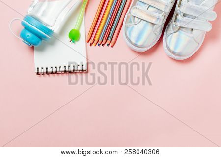 Children Clothes And Study Stuff: Sneakers, Pencils, Bottle Of Water And Electron Gps Watches.