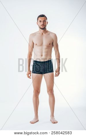 Full Length Portrait Of A Young Sexy Muscular Male Model In Underwear.  Man Beauty
