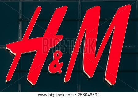 Parnu, Estonia - December 14, 2017: Close Red Logotype H M Of Hennes Mauritz Brand At Wall Of Store 